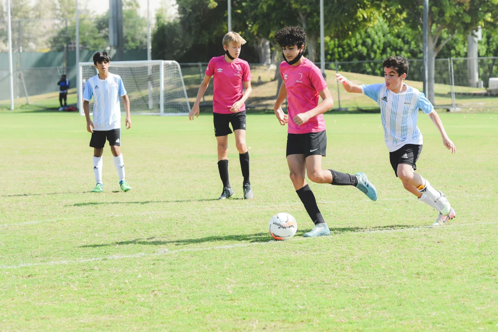 Youth soccer players competing on the field
